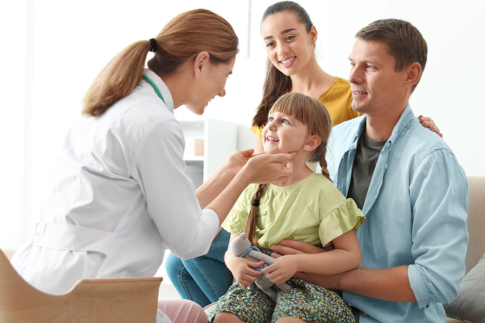 patient and parents talking to physician