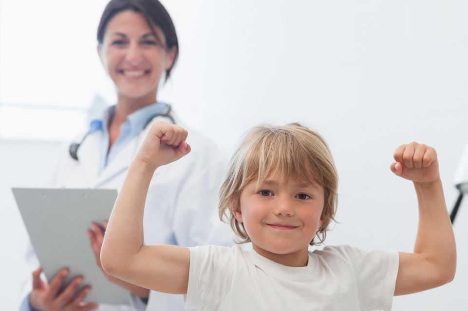 patient flexing muscles while physician looks on