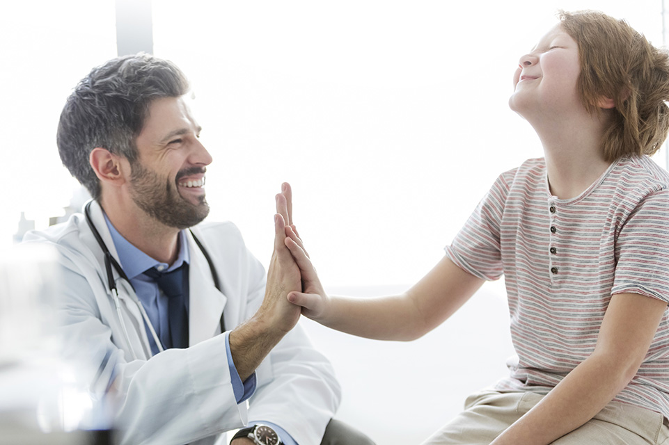 physician and patient share a high five