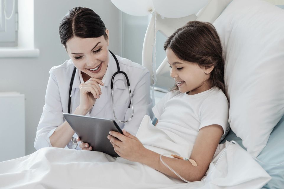 patient and physician looking at tablet