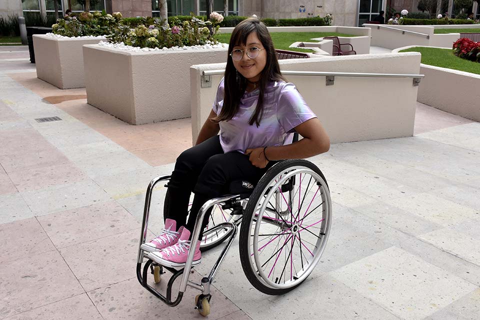 female orthopedic patient sitting in wheelchair