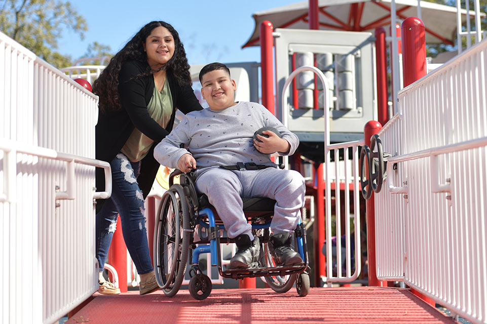 patient in wheelchair on playground